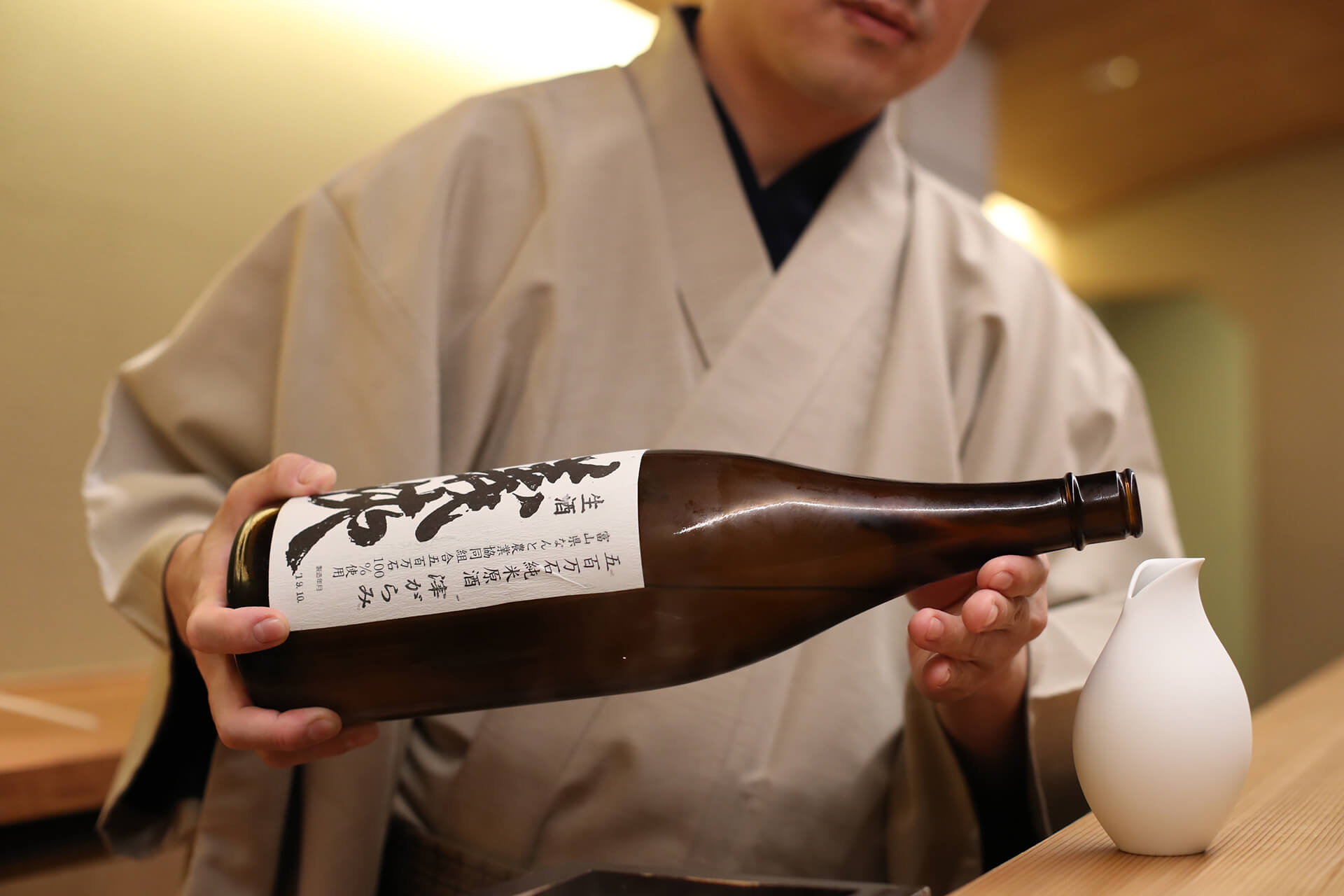 Serving sake in a Tokkuri, a sake-serving pitcher